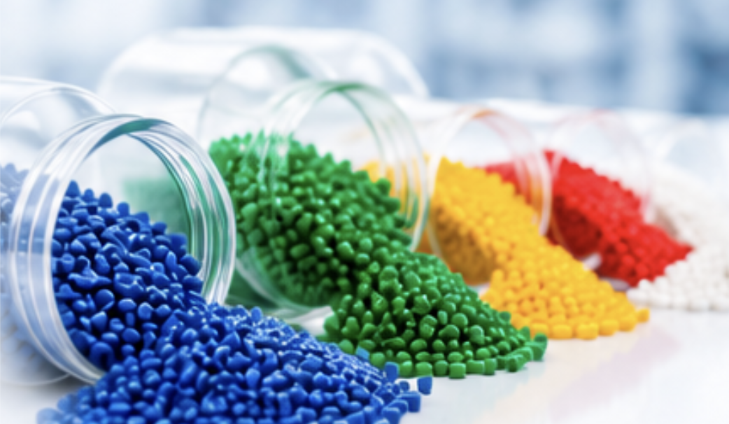Colourful masterbatch granules in glass jars
